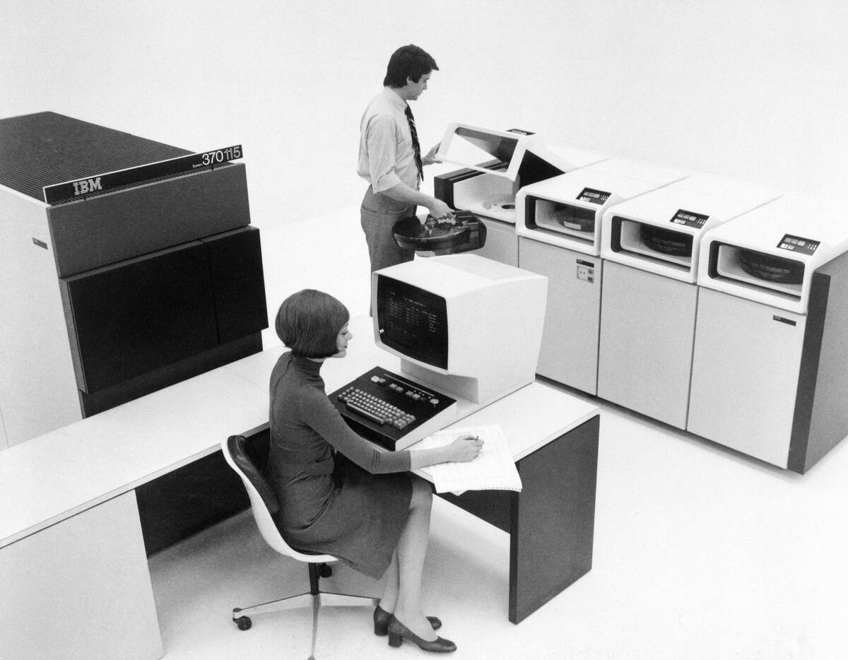 People Using IBM 370115 Computer