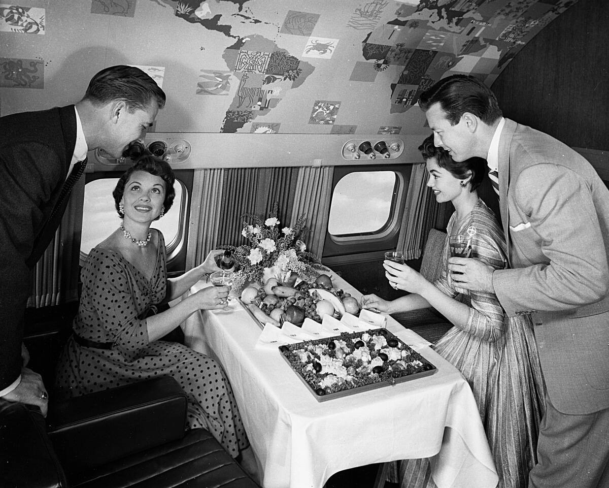Some People Serve Themselves From A Buffet On An Aeroplane