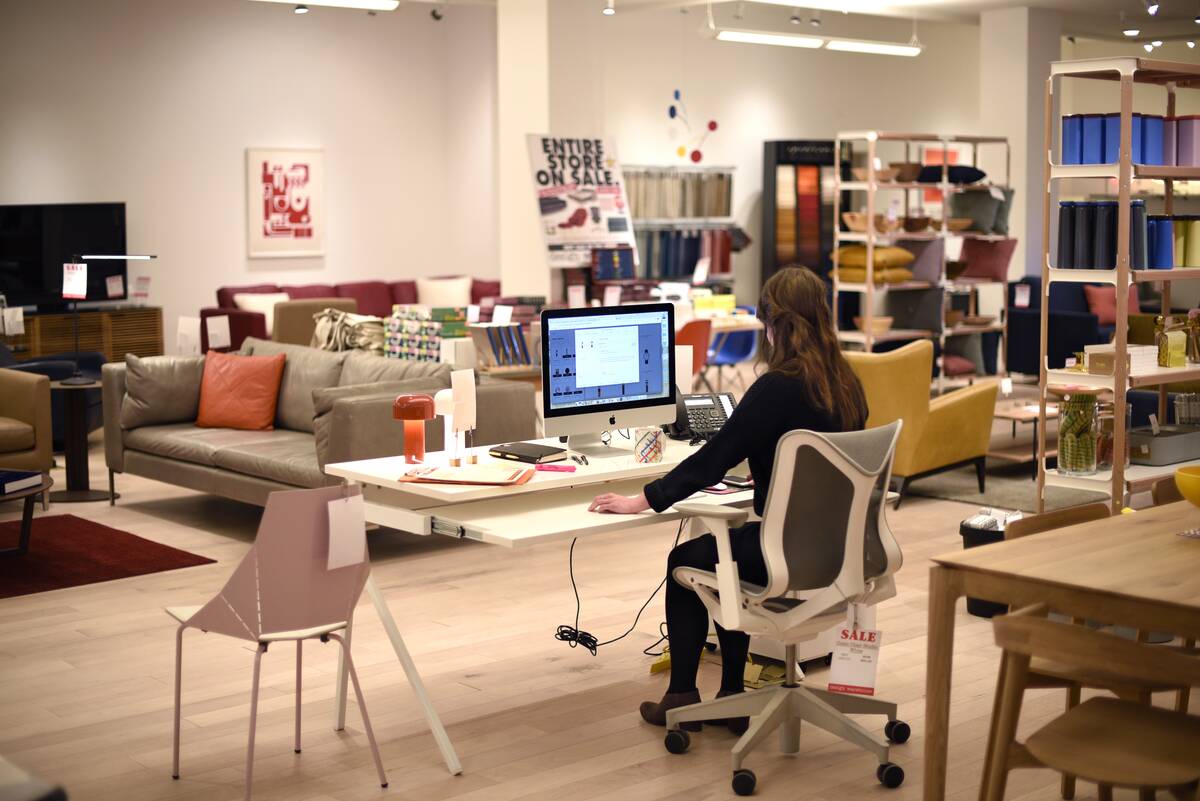 Store employee working at a computer
