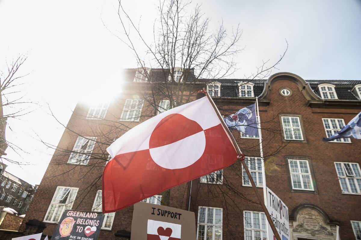 The Greenland flag is seen during the demonstration against...