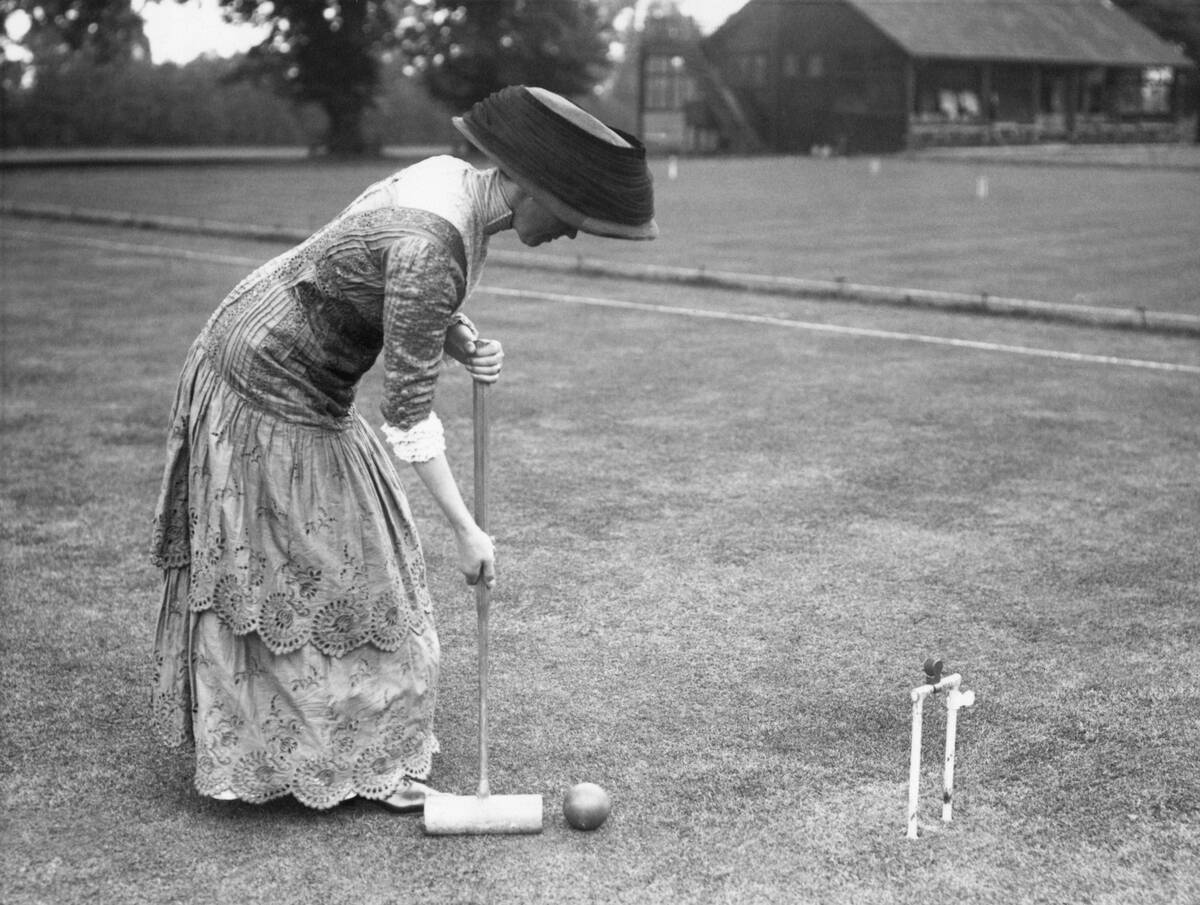 Well Dressed Lady Playing Croquet