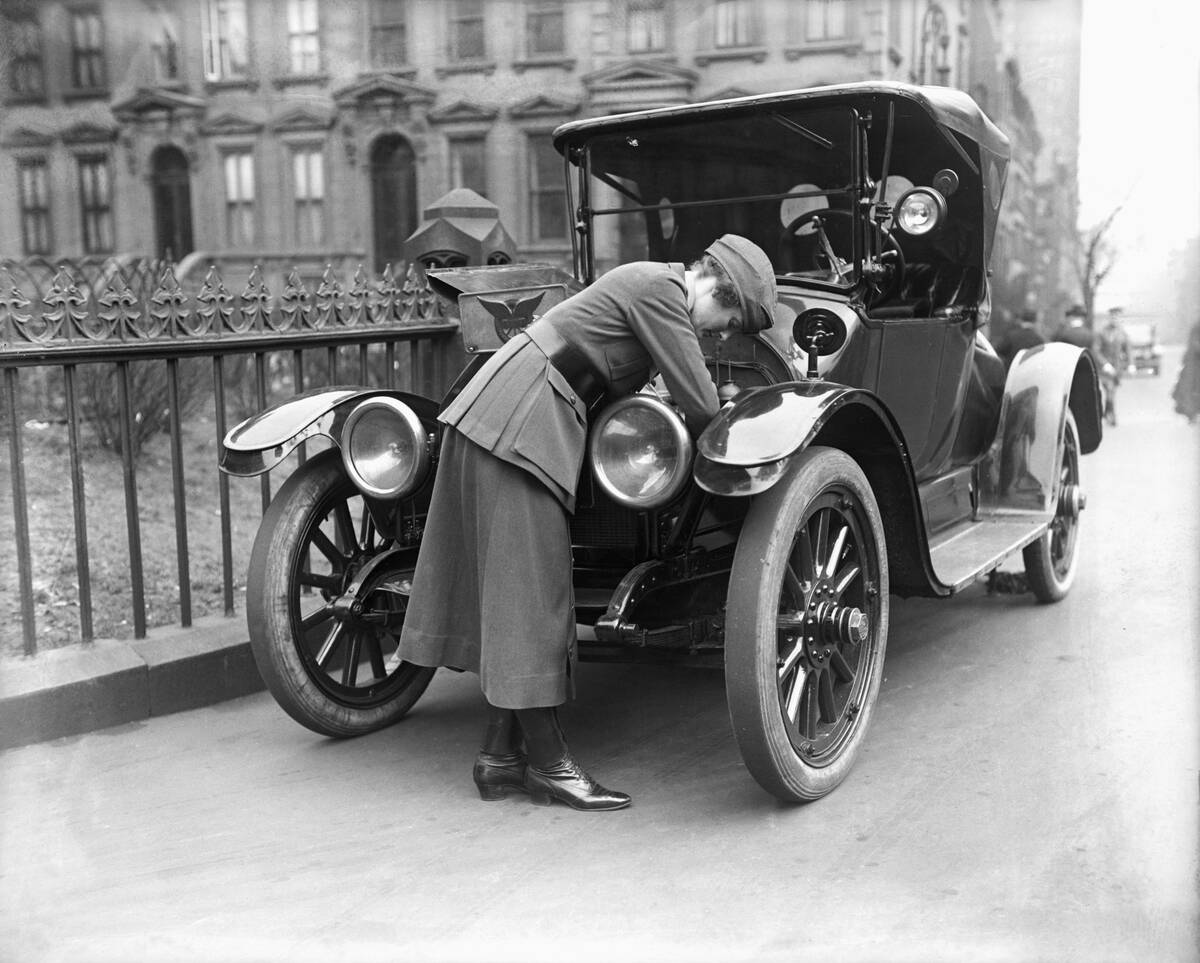 Wwi Female Volunteer Fixing Automobile