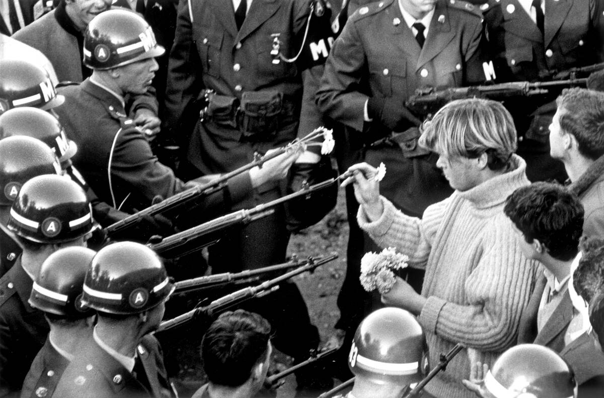 Antiwar demonstrators tried flower power on MPs blocking the Pentagon Building