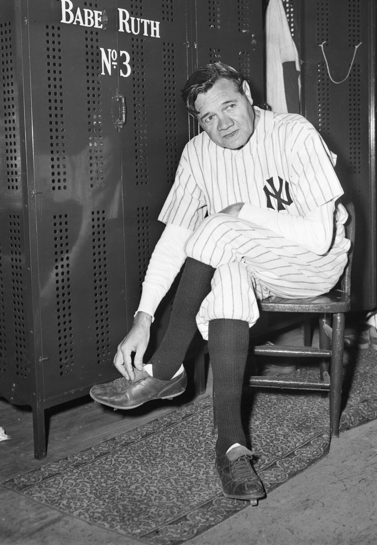 Babe Ruth Taking off Uniform