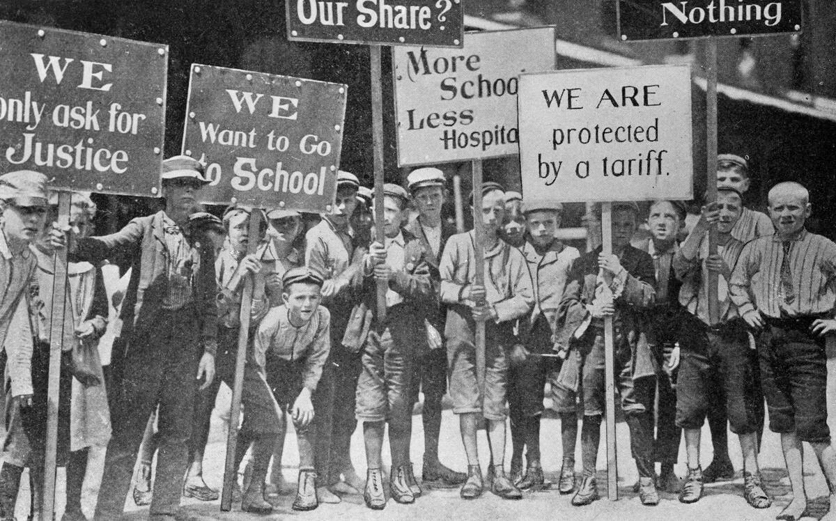 Child Textile Workers Holding Protest Signs During Strike