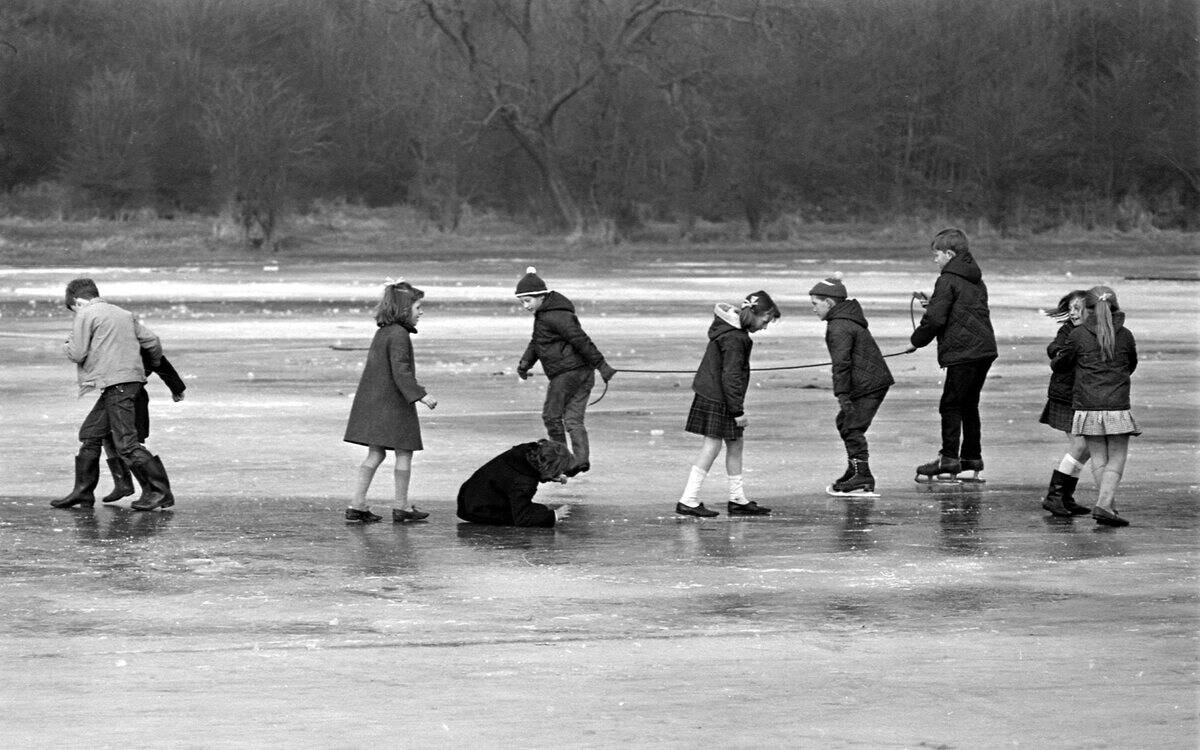 Children enjoy skating on the ice