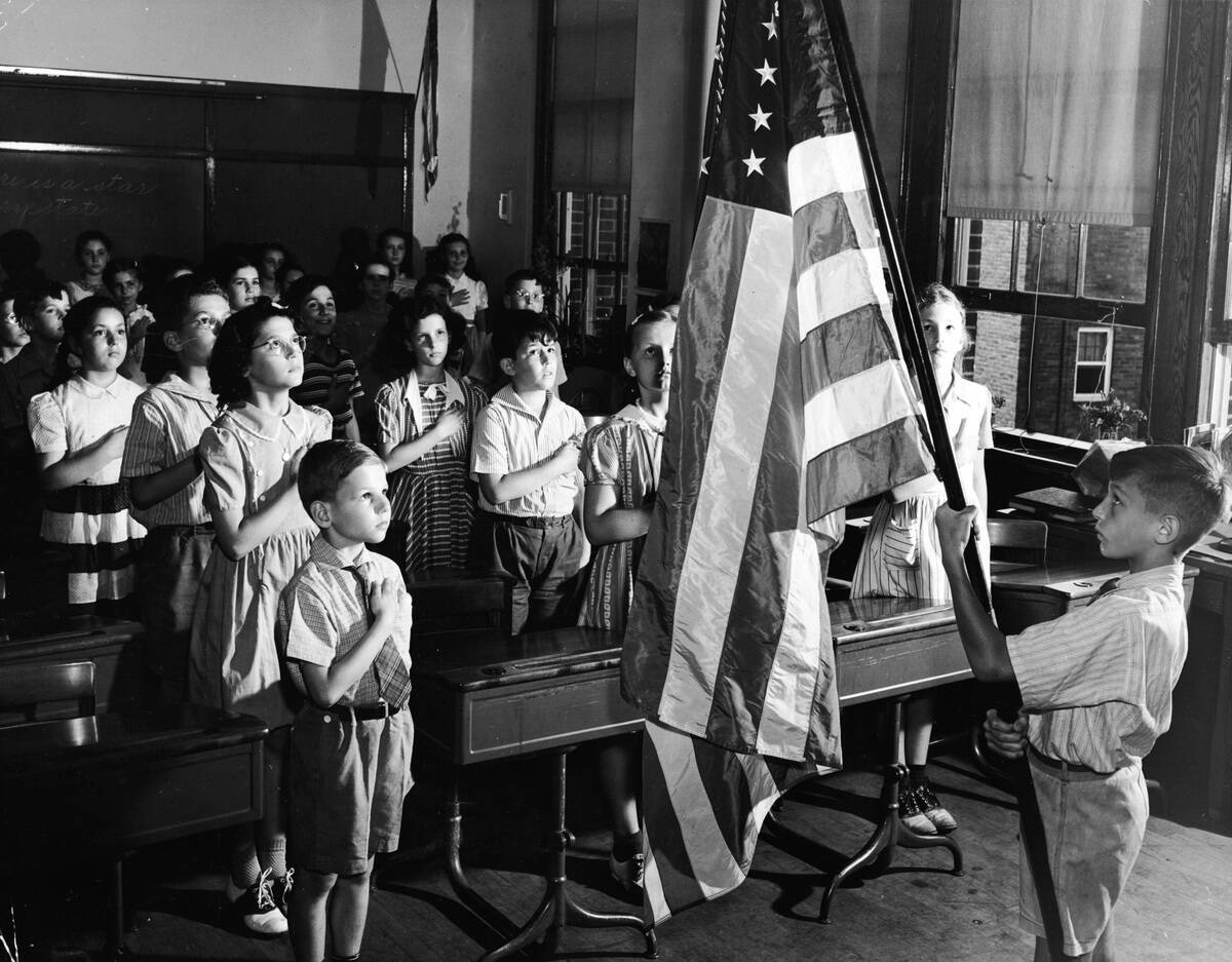 Children Pledging Allegiance In Classroom