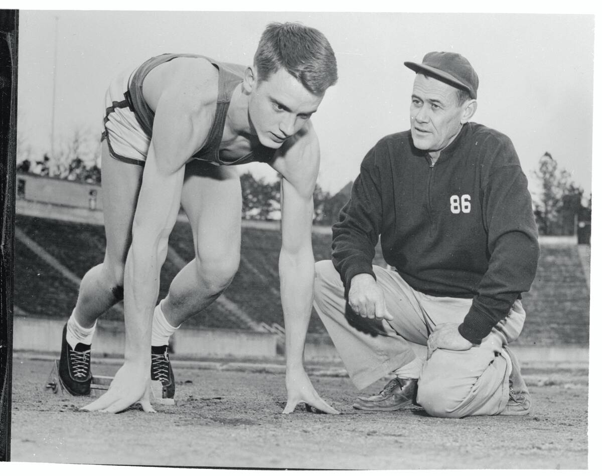 Dave Sime Reaching Instructions From His Coach