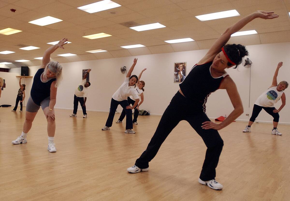 DENVER,CO--NOVEMBER 13TH 2003--Diane Freed, right, along with others work out during Valarie Valdez' Jazzercise class at 1975 Sheridan Thursday afternoon. THE DENVER POST/ ANDY CROSS