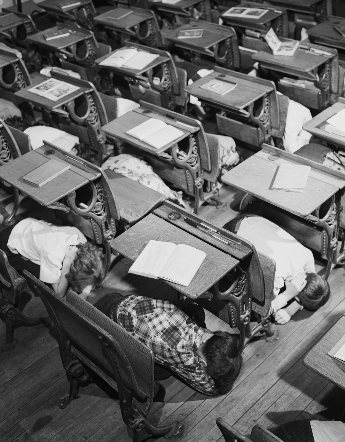 Duck and Cover Drill in School Classroom