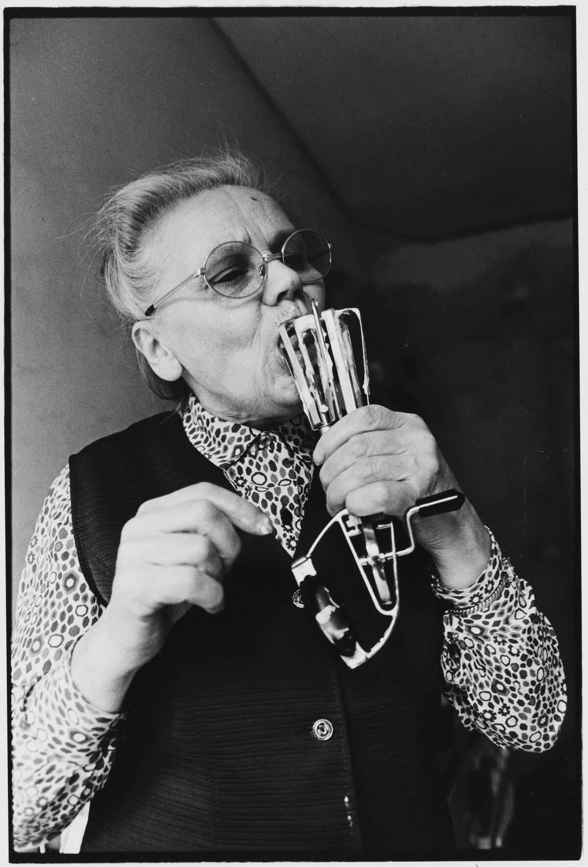 Elderly Woman Licking Hand Blender