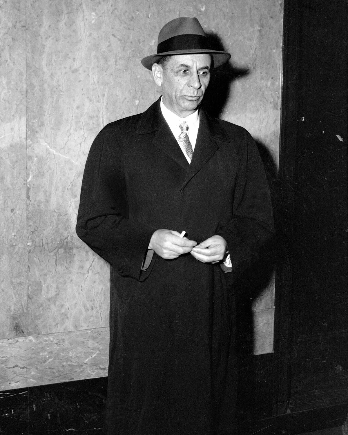 Gambler Meyer Lansky leaves uptown court at 151 St. and Conv