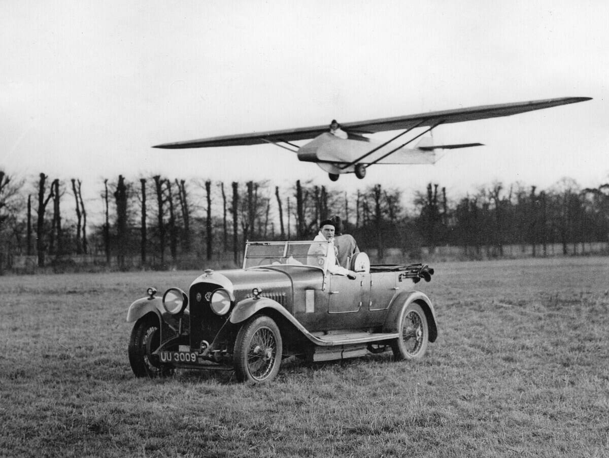 Glider, towed by a car, rises to height, Training of air pilotes of the Hanworth Flying club, England, Photograph, 1931