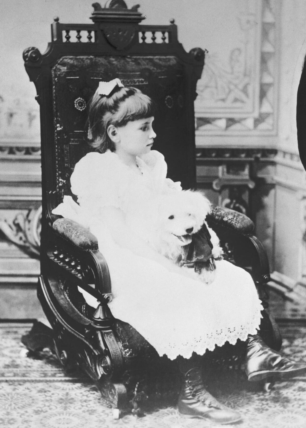 Helen Keller Holding Pet Poodle in Chair