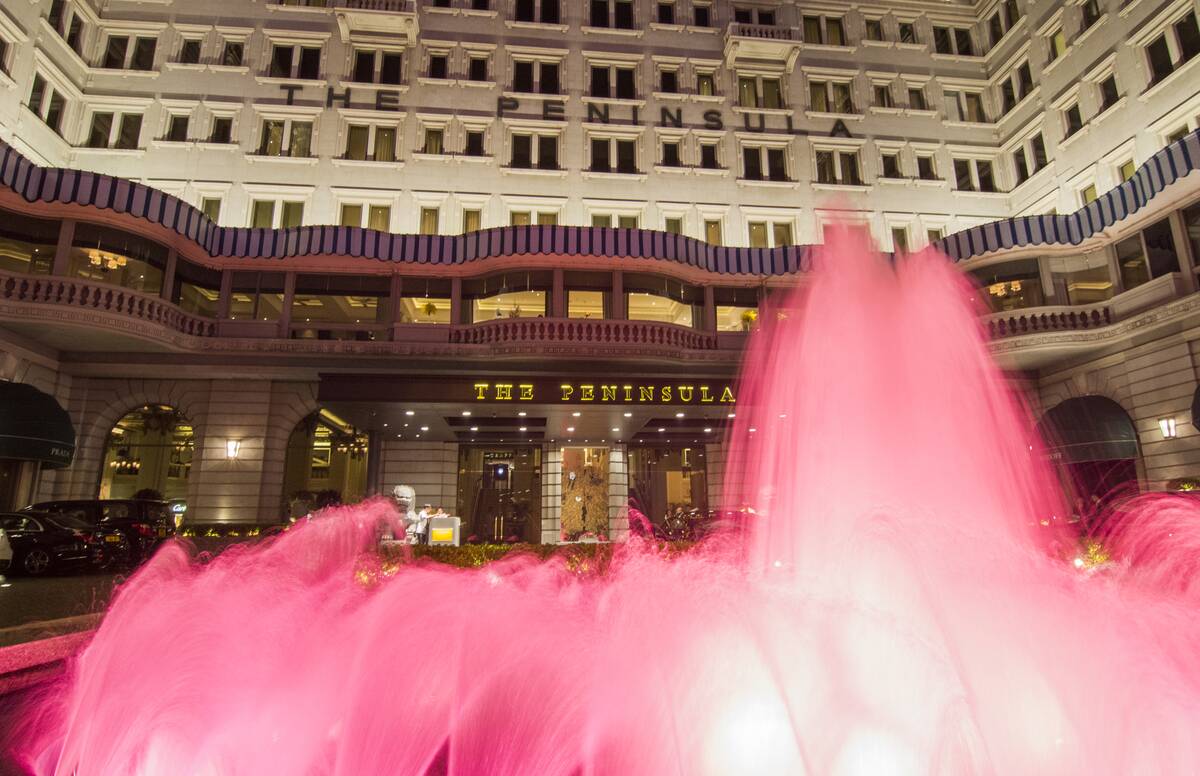 Hong Kong China Peninsula Hotel pink fountains in front of expensive exclusive hotel in Kowloon