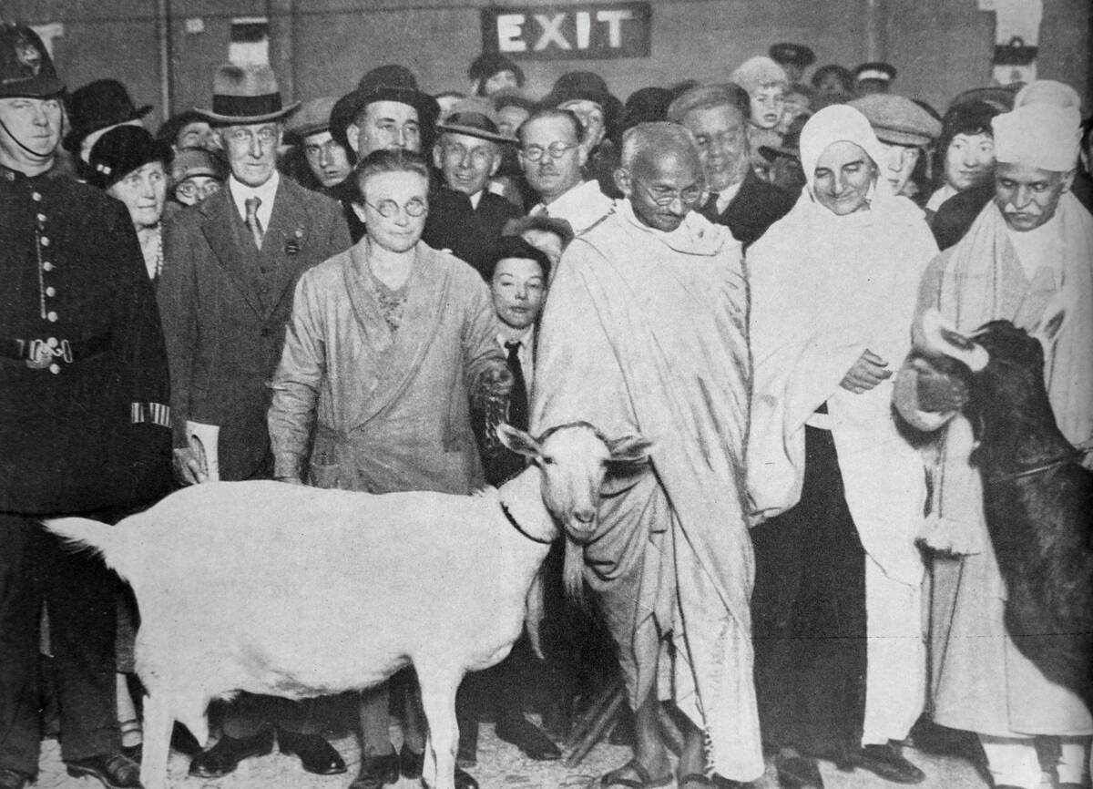 Mahatma Gandhi with his supporter, Madeleine Slade, and two goats.