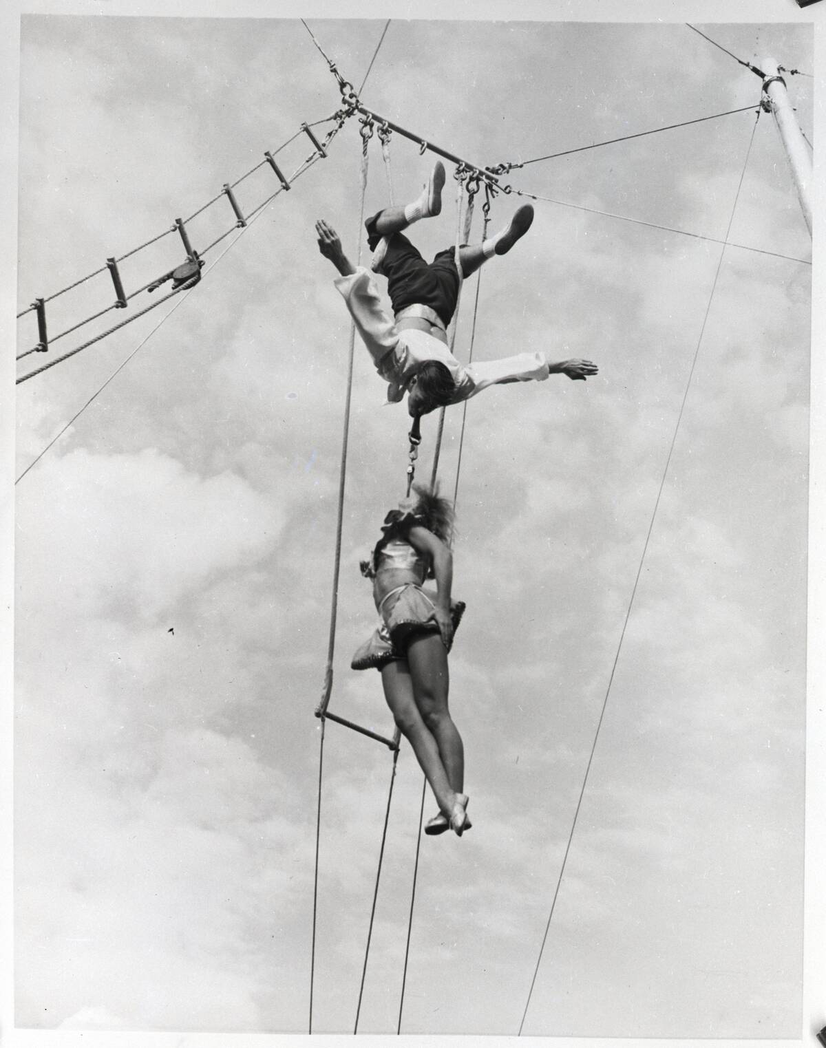 Man And Woman Doing High Wire Act