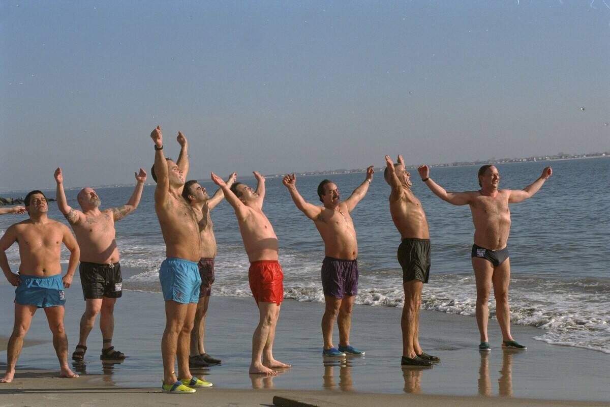 Members of the Polar Bear Club warm up before taking the plu