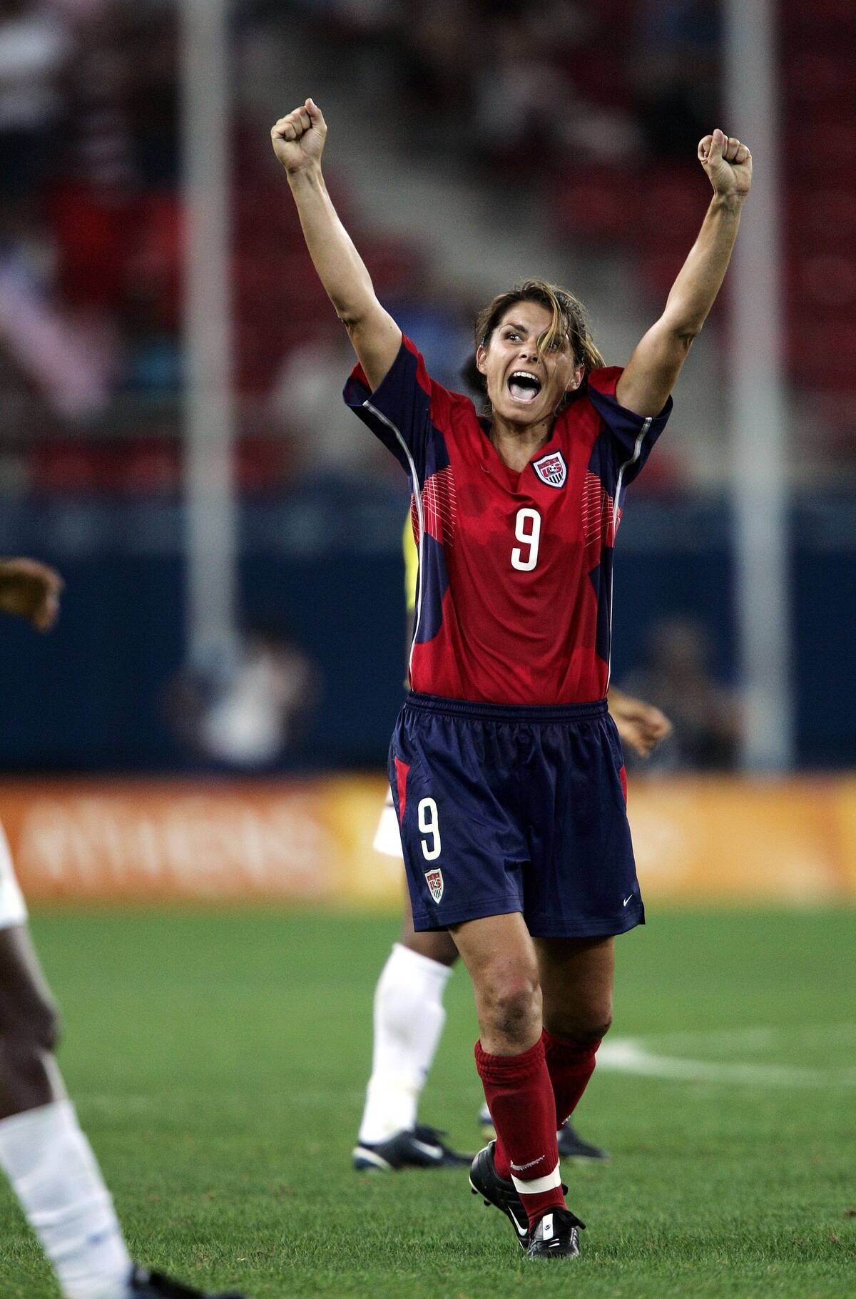 Mia Hamm of the United States celebrates after she and her t