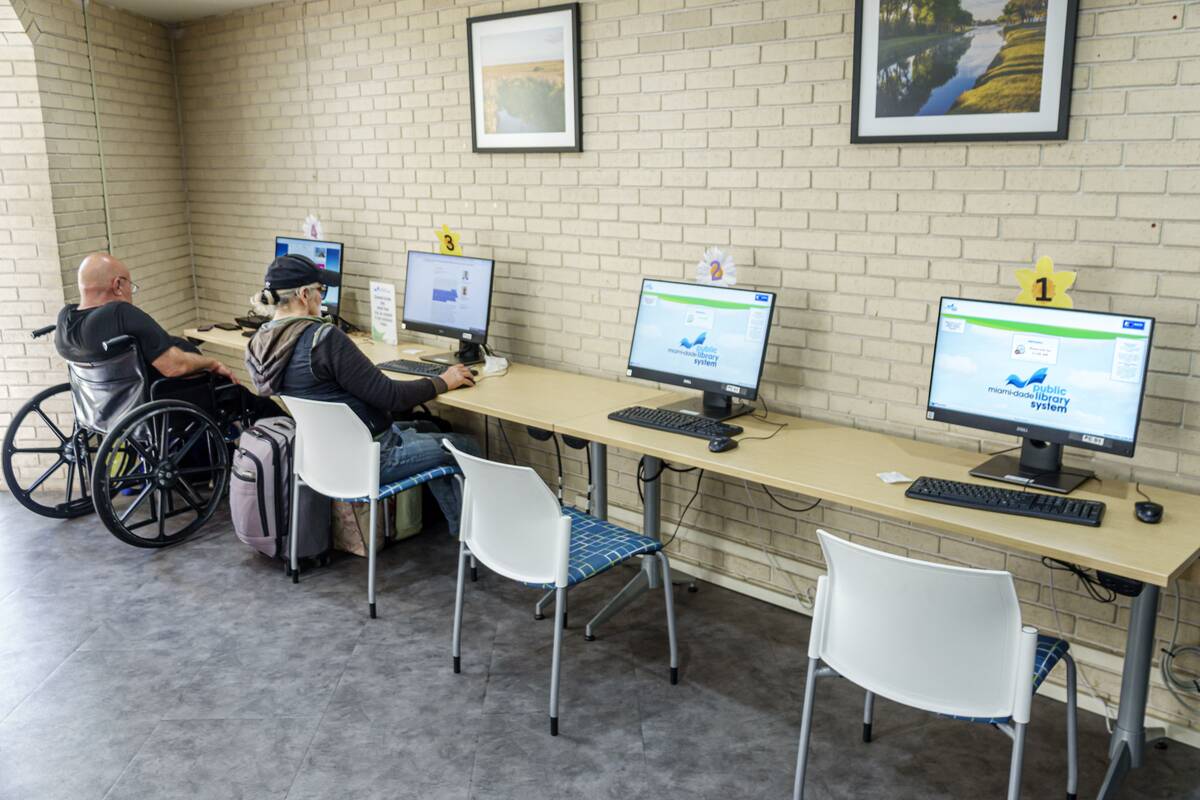 Miami Beach, Florida, North Shore Library Branch, Internet access, computers with senior woman and man in wheelchair