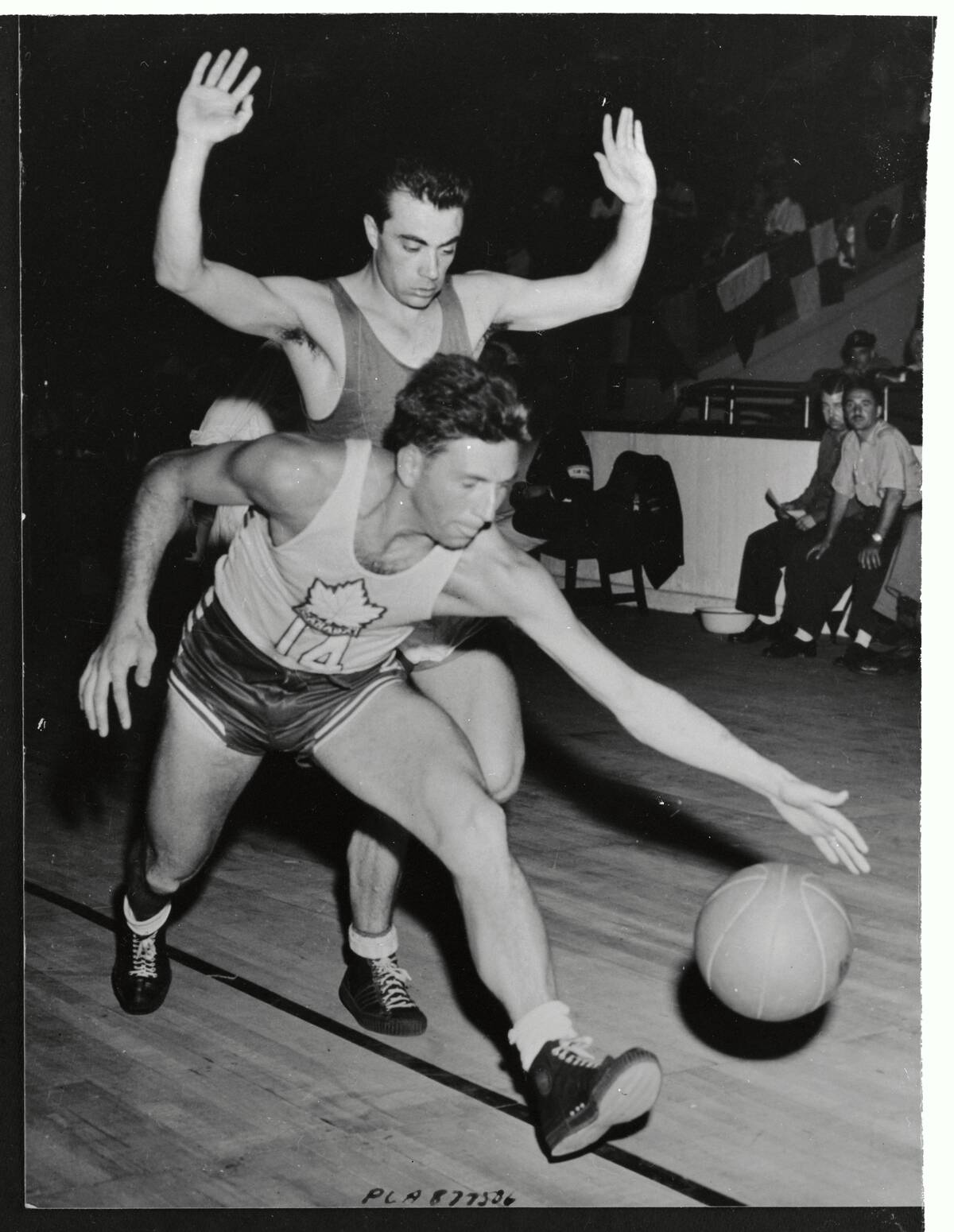 Players Running After Basketball During Olympic Game