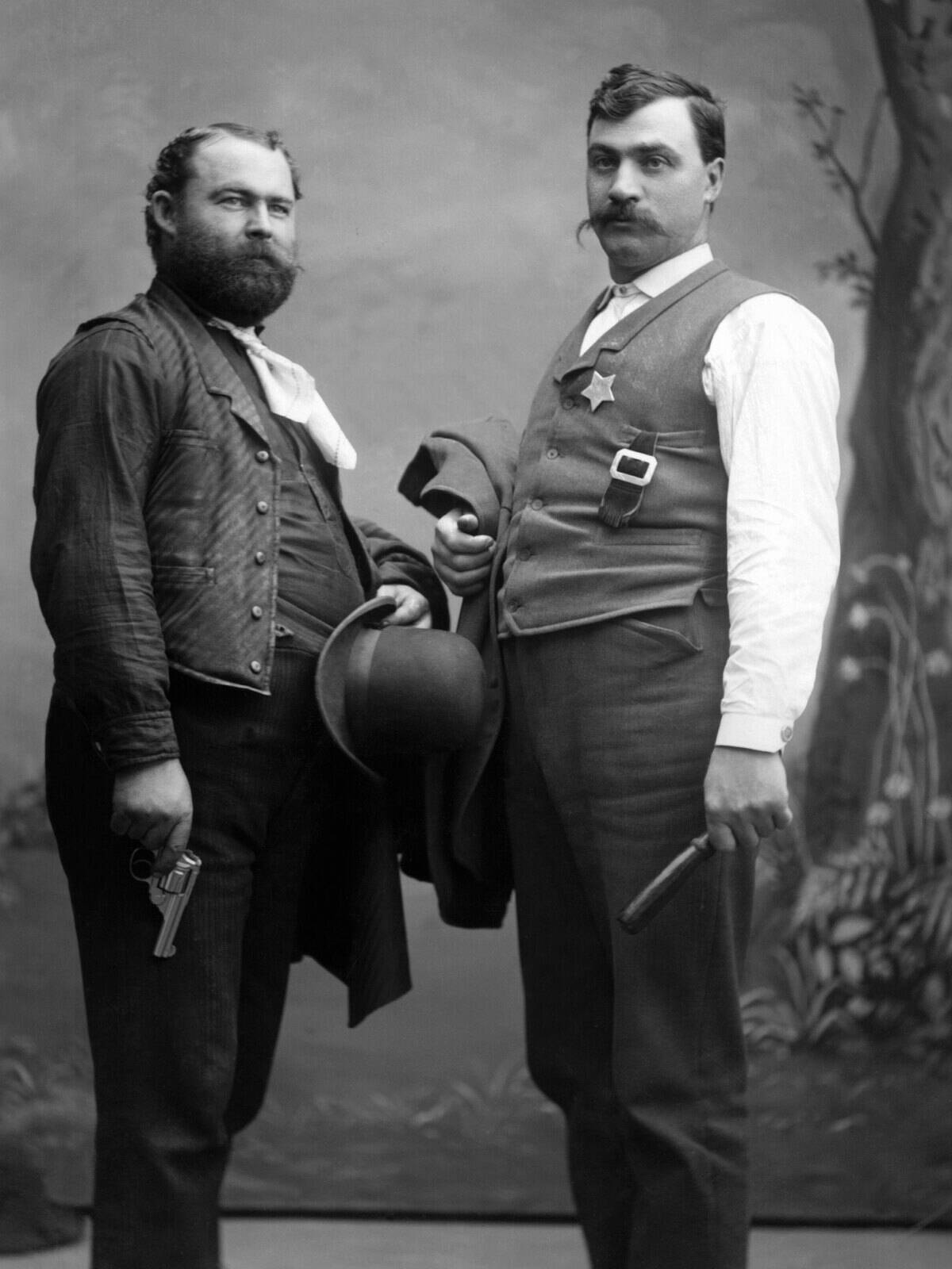 Sheriff And Deputy With Guns