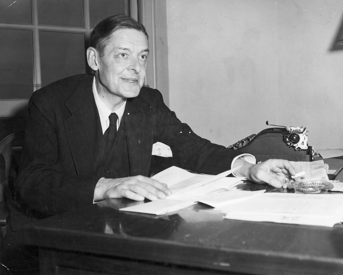 T S Eliot at Desk Inspecting Manuscripts