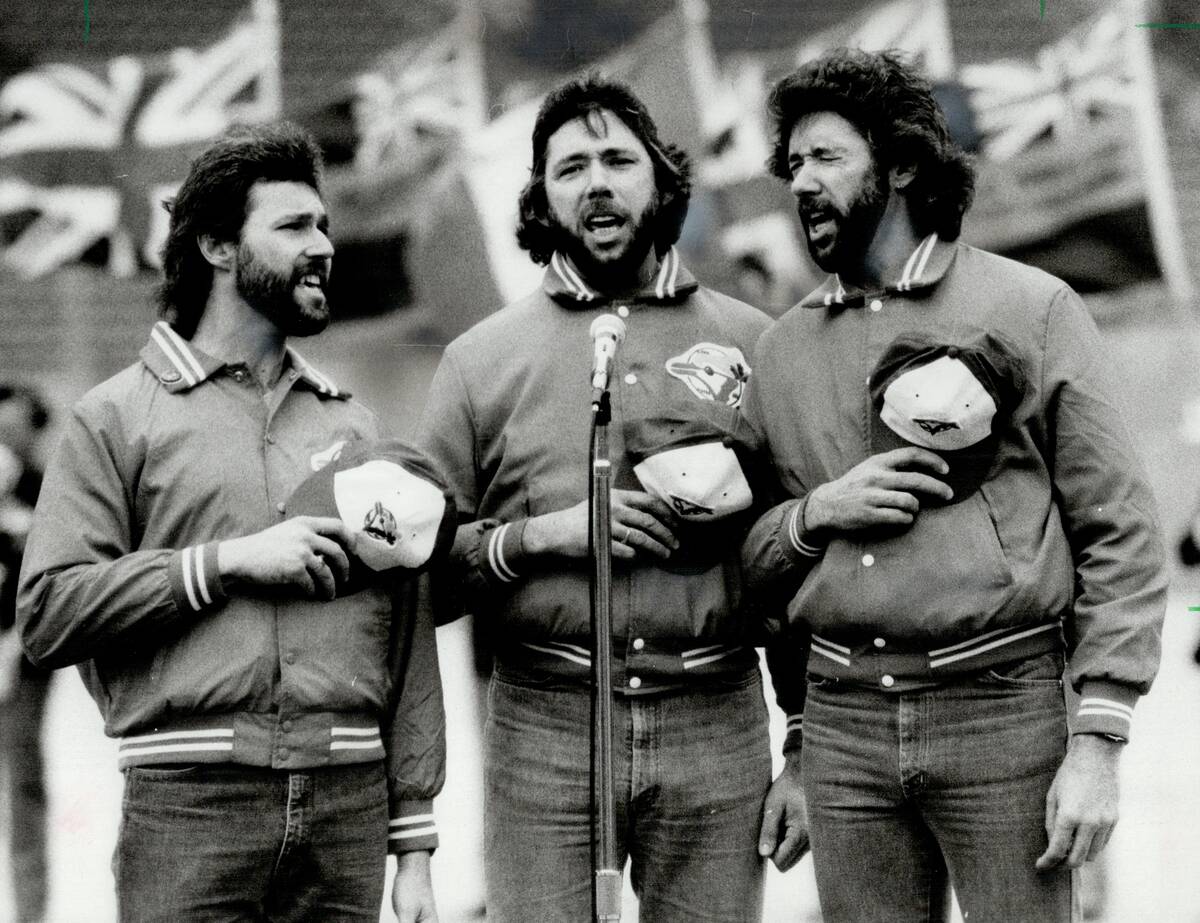 The Good Brothers; their Blue Jay pride plain to see; belt out the national anthem