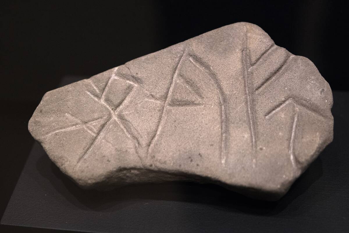 The Viking's objects: Whetstone with rune carving. The...