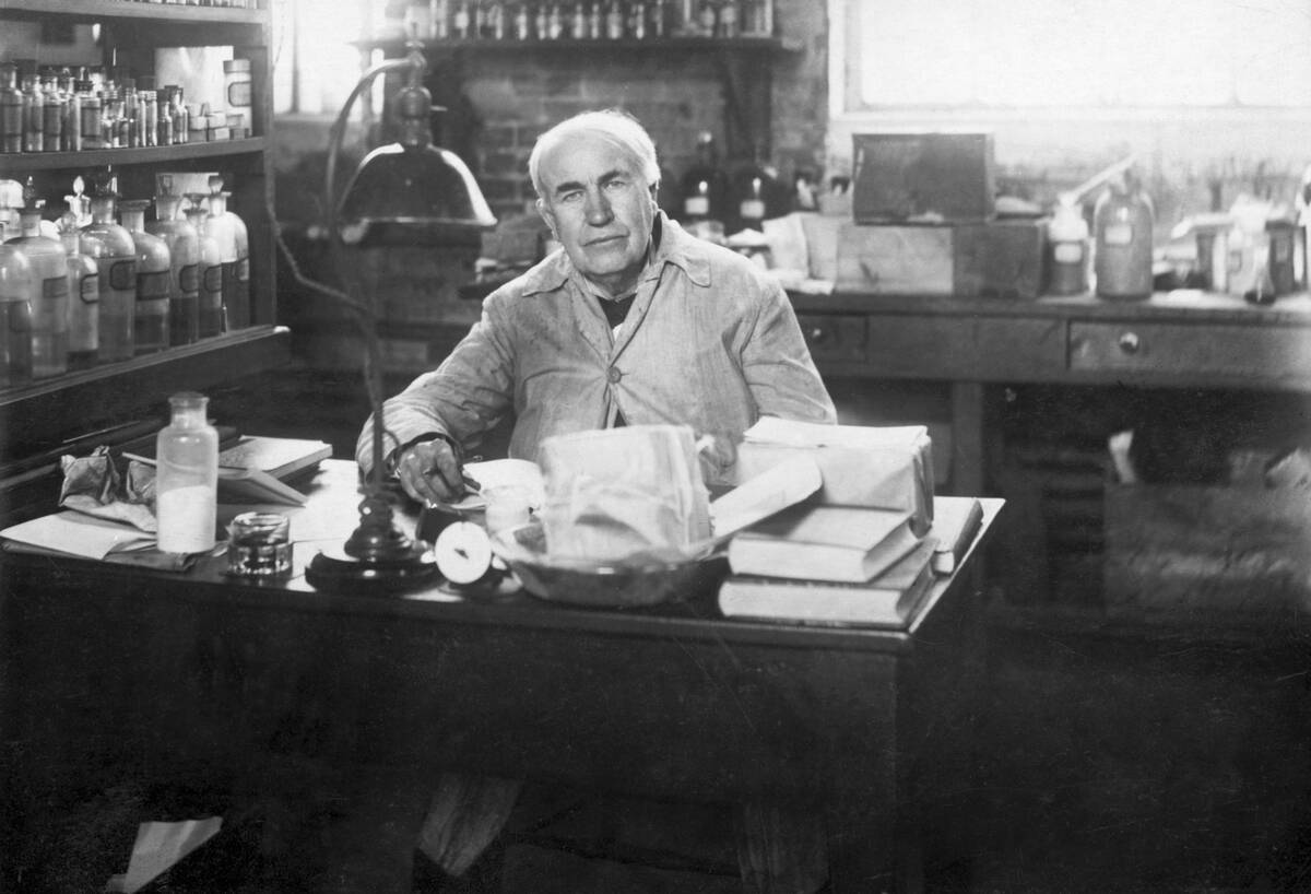 Thomas Edison Seated At Desk In Lab