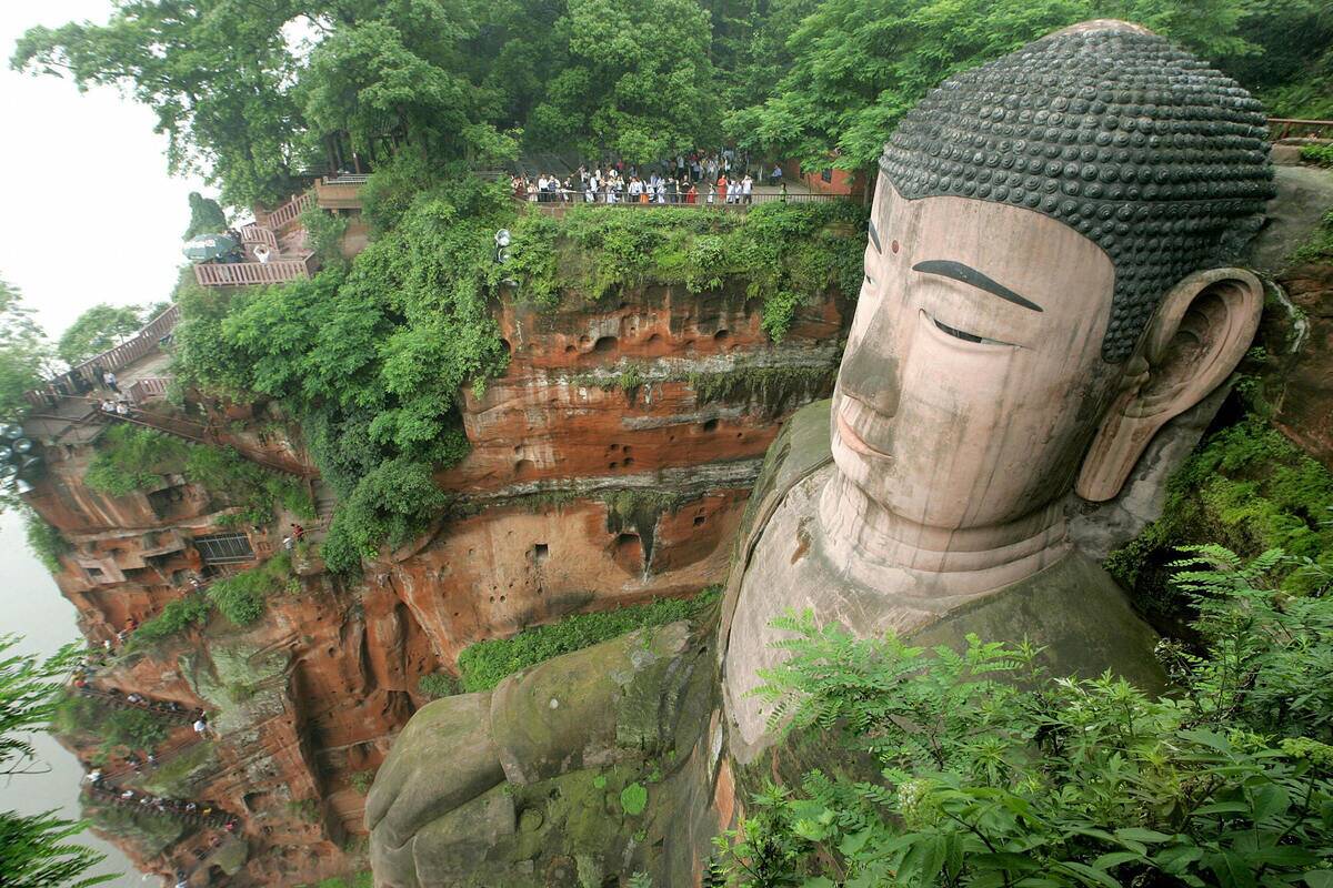 Tourists visit the 71-metre (234-feet) t