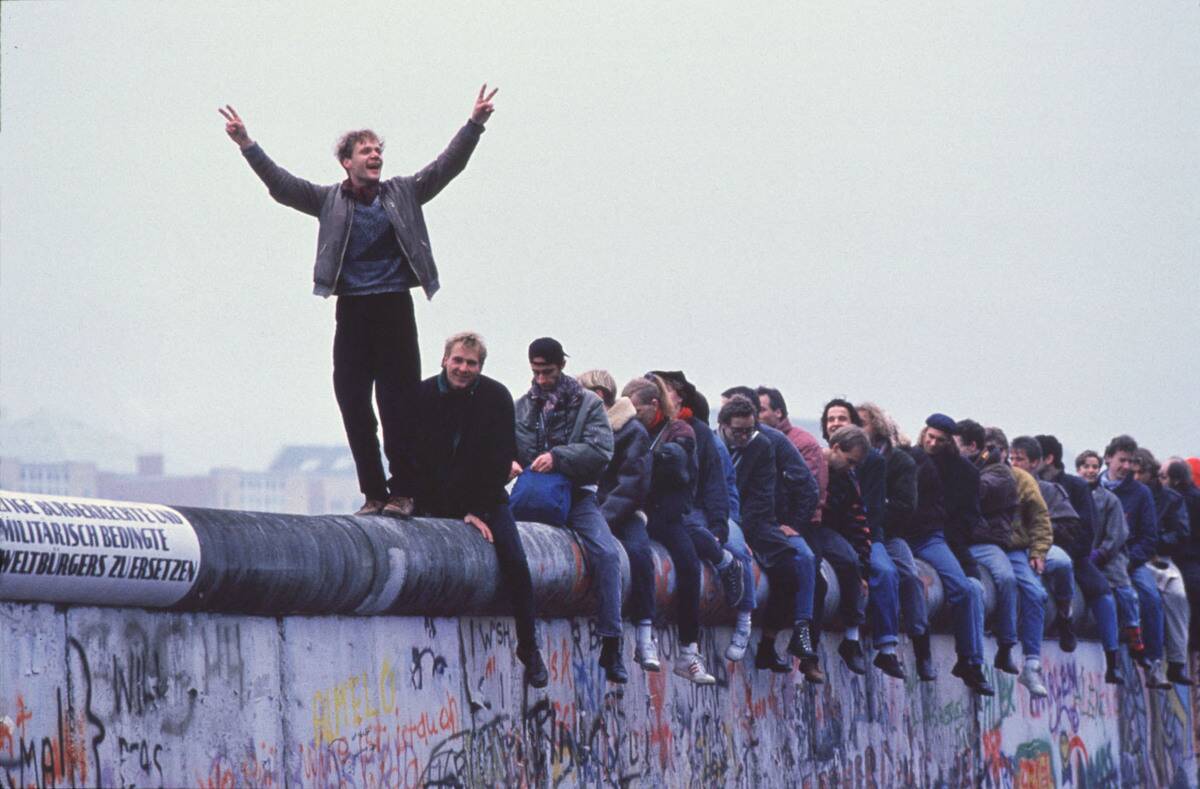 West Germans Celebrate The Unification Of Berlin Atop The Berlin Wall During The Collaps...