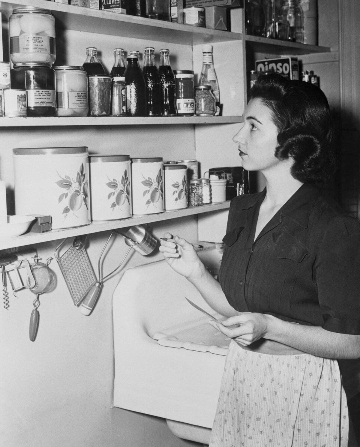 Young Woman Checking Her Pantry