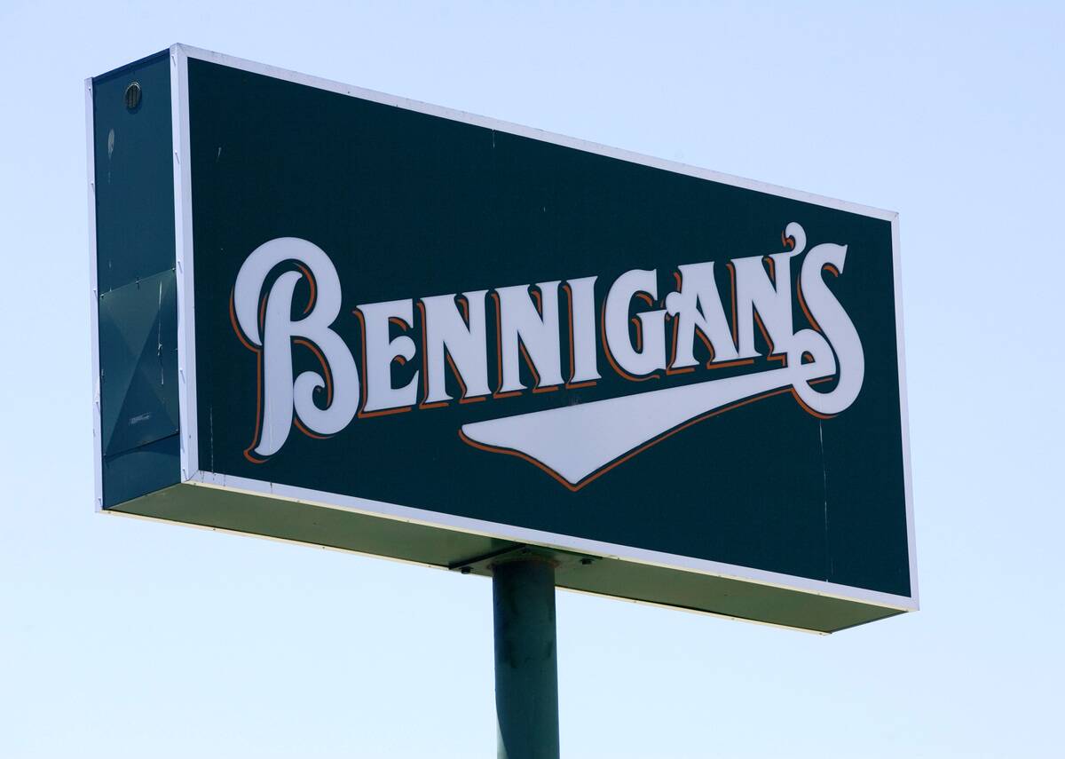 A Bennigan's restaurant sign sits outside the restaurant in