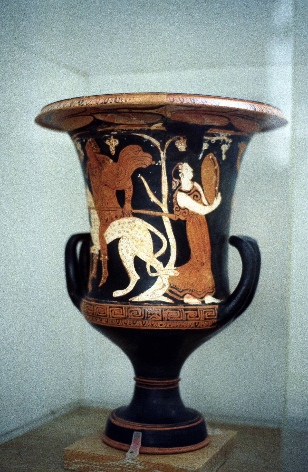 Ancient Greek vase with red figure decoration, including a female dancer, 5th century BC.