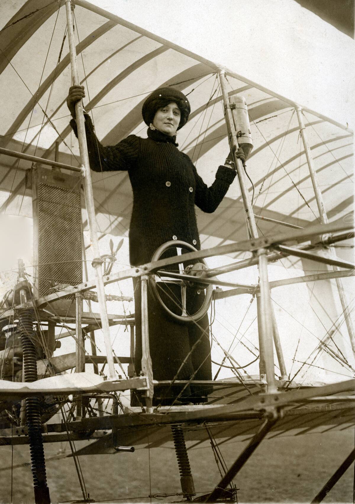 Baroness Elise Deroche Standing on the Wing of an Early Airplane