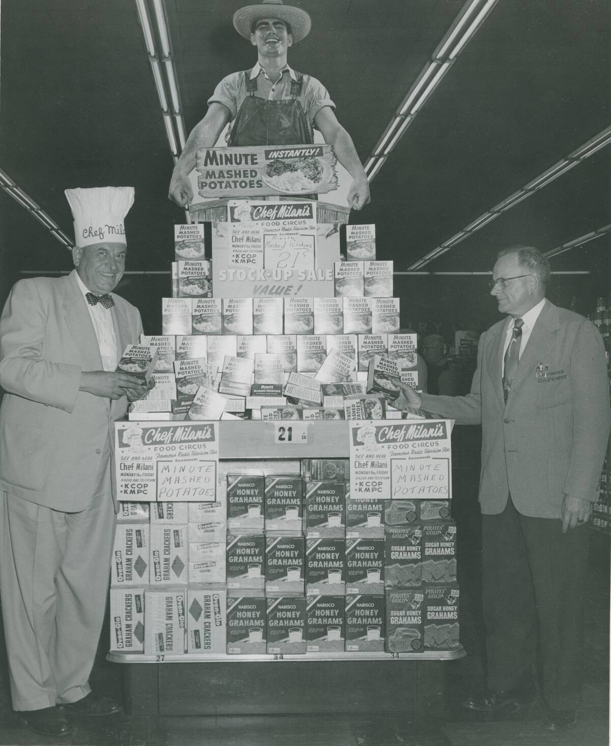 Chef Milani with retail display in grocery store.