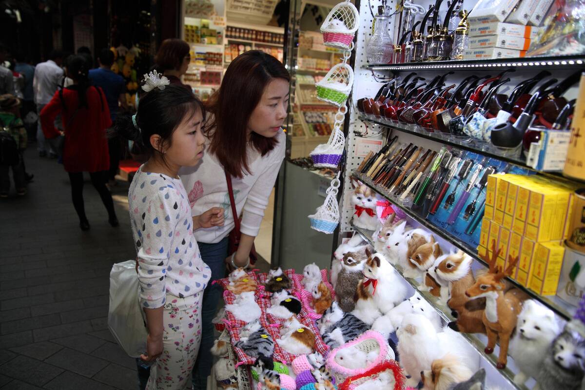 Chinese mother and daughter do window shopping