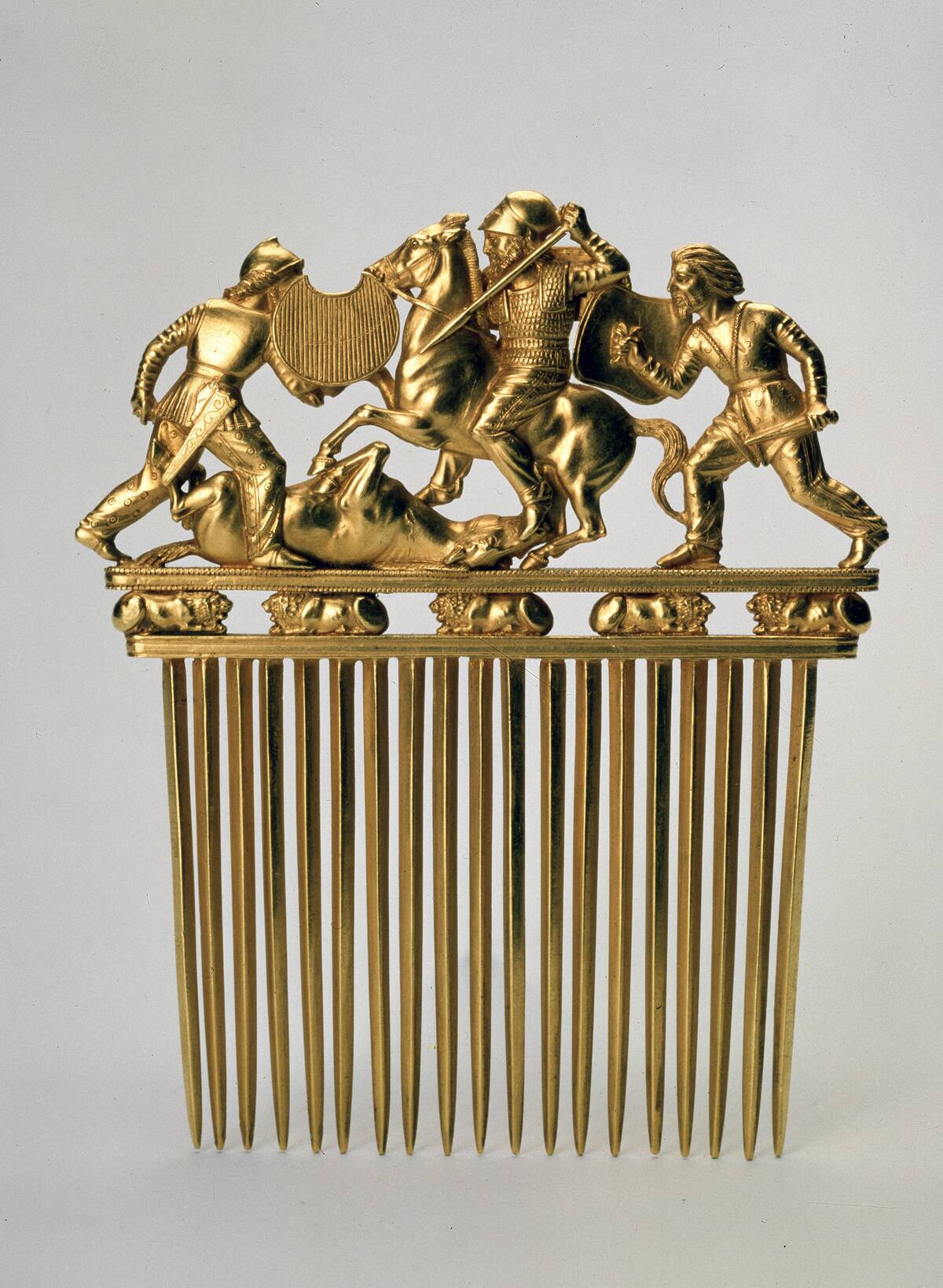 'Comb with a fighting scene', c400 BC. 'Comb with a fighting scene', c400 BC.