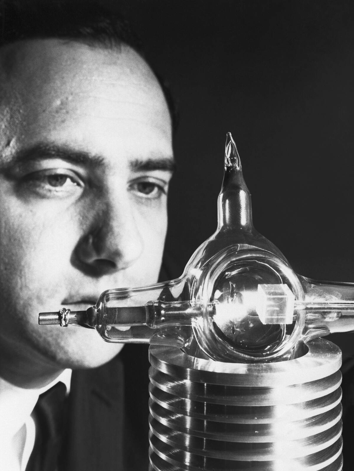 Dr. Theodore Maiman Looking at the Ruby Used to Create the First Laser Beam
