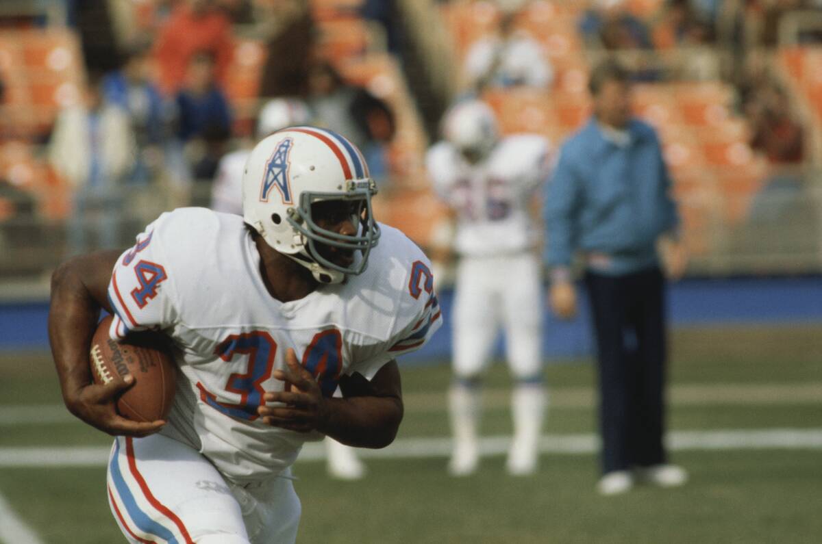 Earl Campbell Running with Football