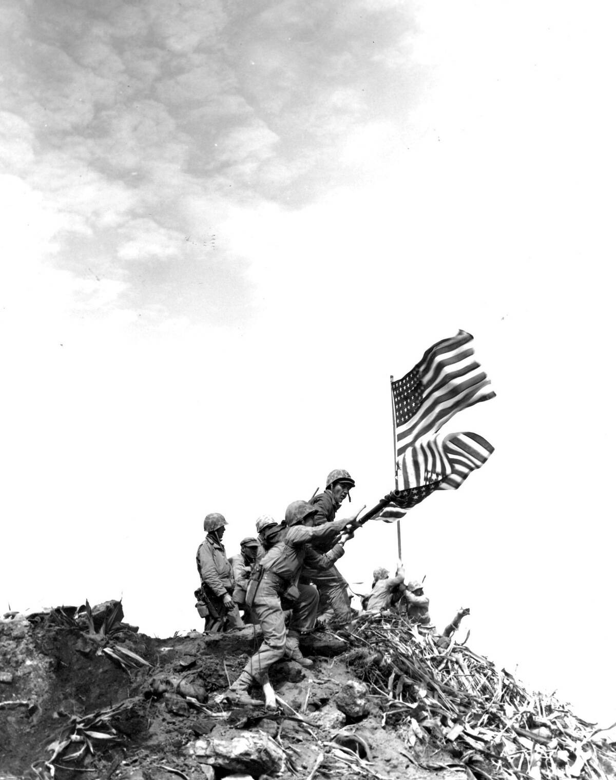 Flag raising on Iwo Jima. Installing large flag on Mt. Suribachi.