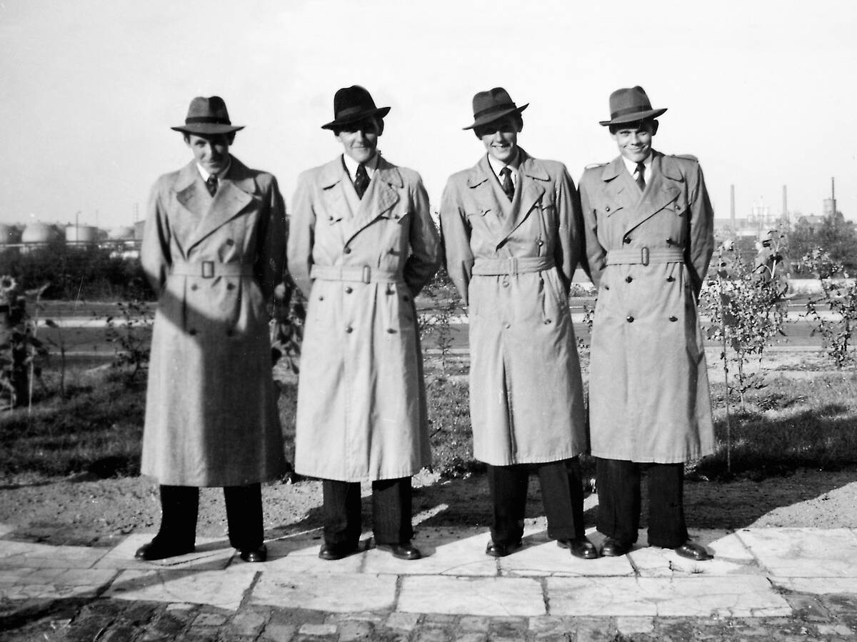 Four men in trench coats, ca. 1940