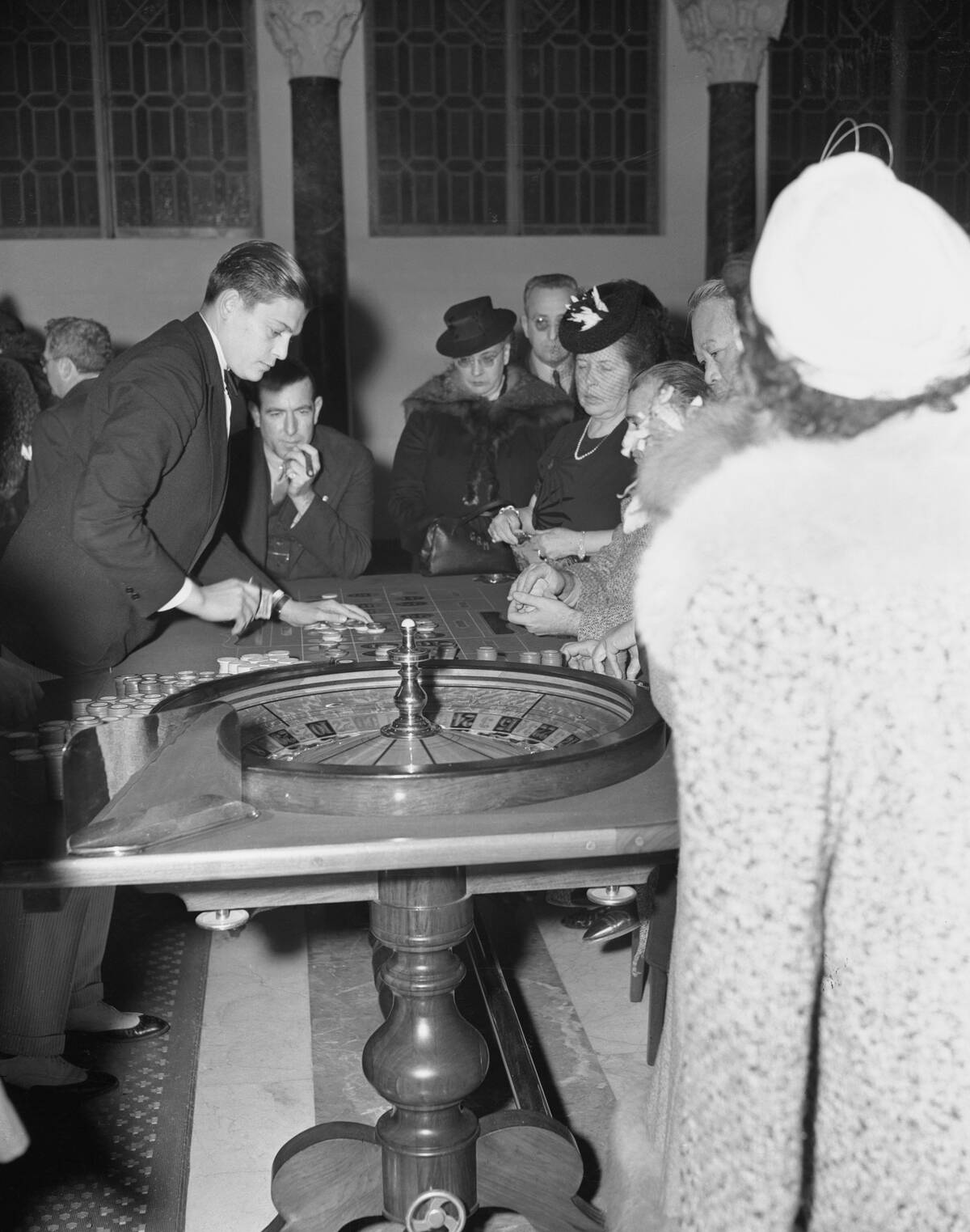 Gamblers at Roulette Wheel