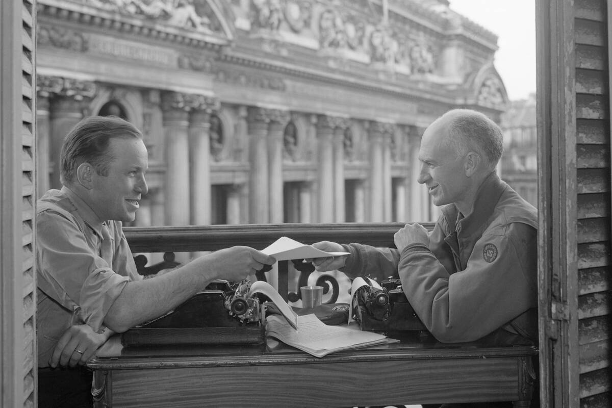 Hal Royle and Enrie Pyle Sit at Typewriter