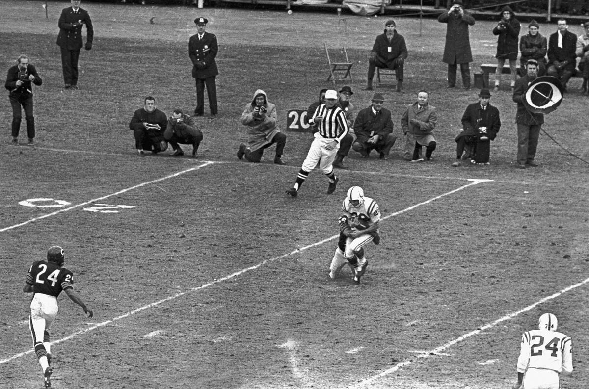 Johnny Unitas Tackled by Detroit Lions Players