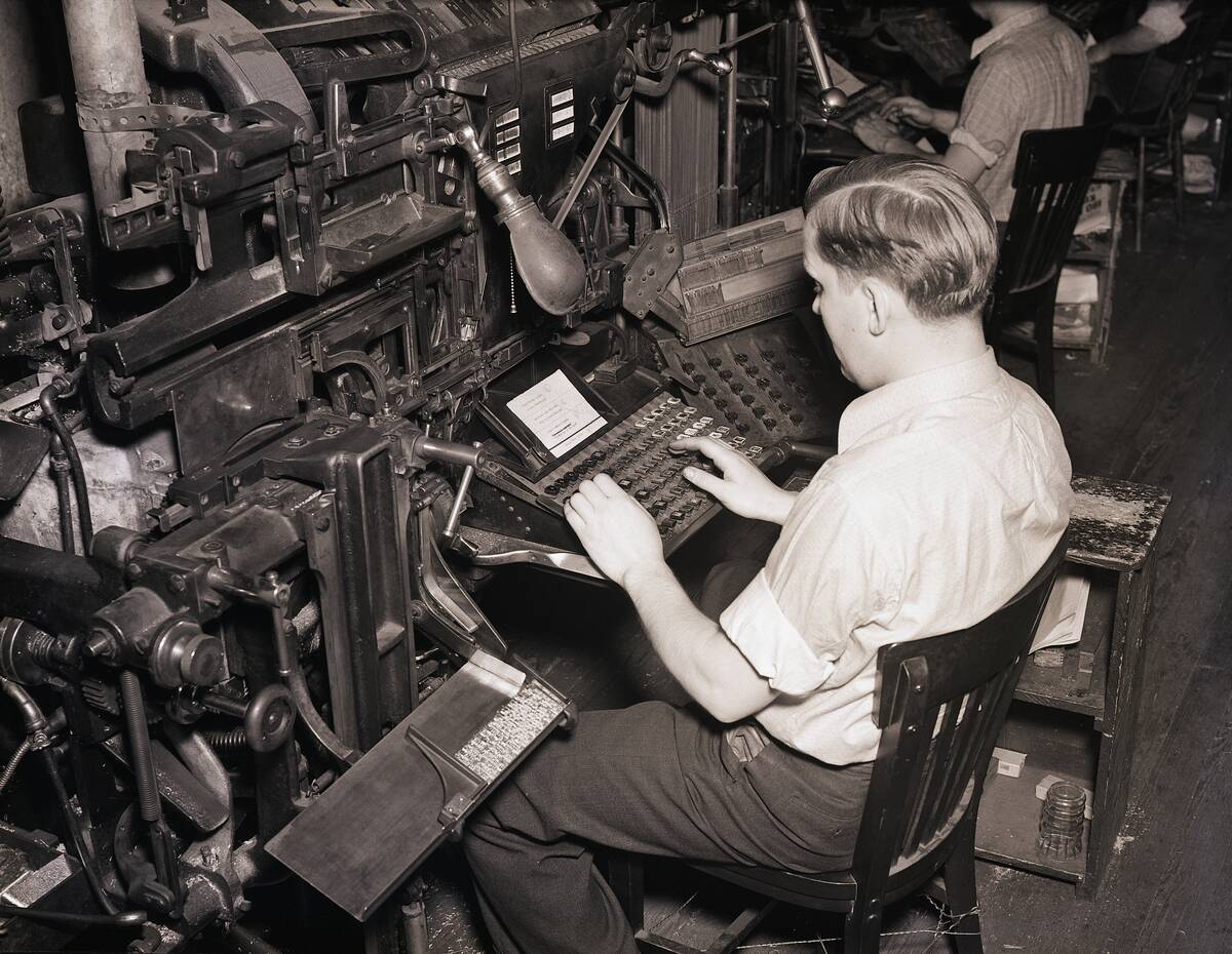 Linotype Operator Seated Working