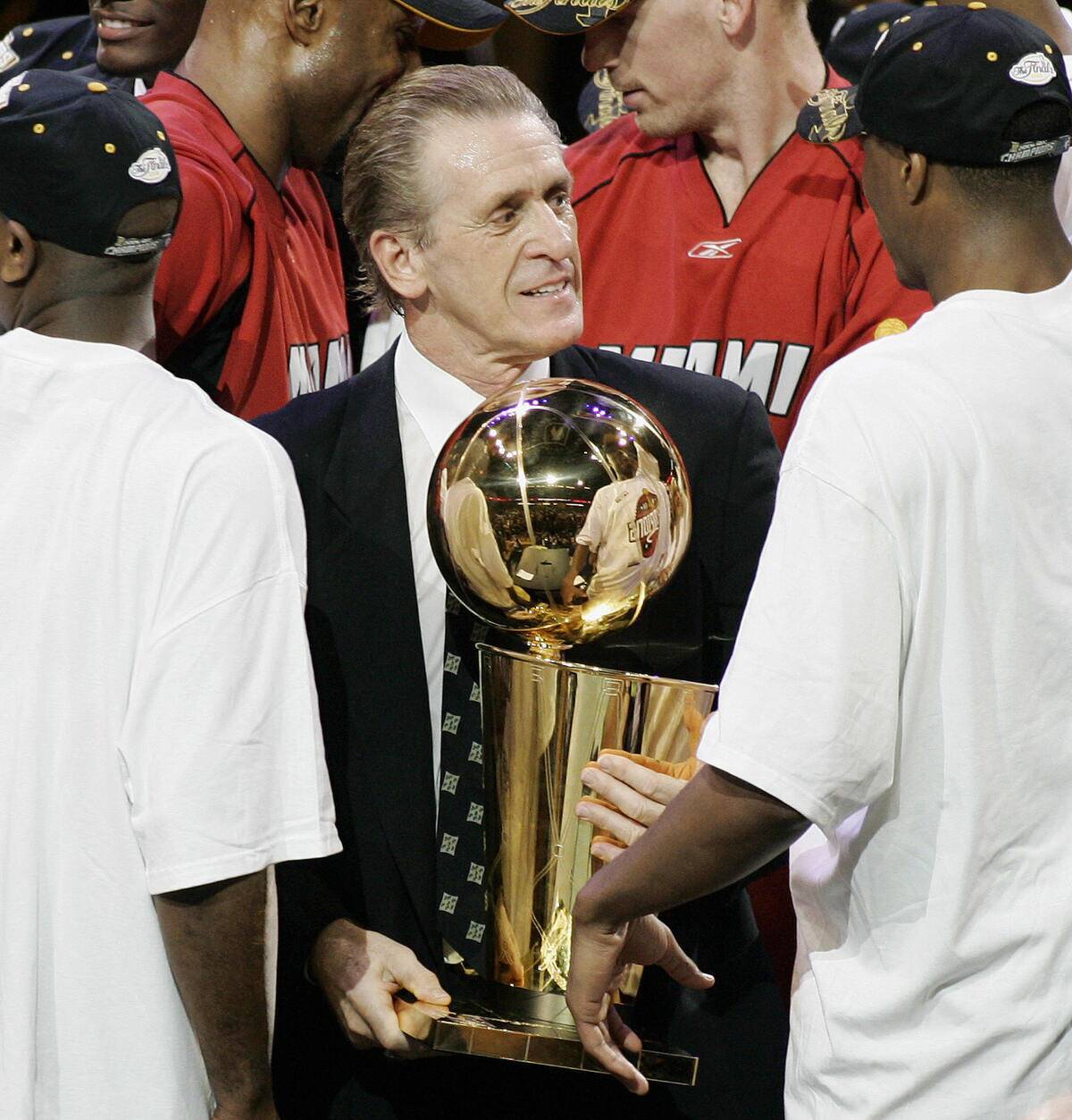 Miami Heat coach Pat Riley holds the tro