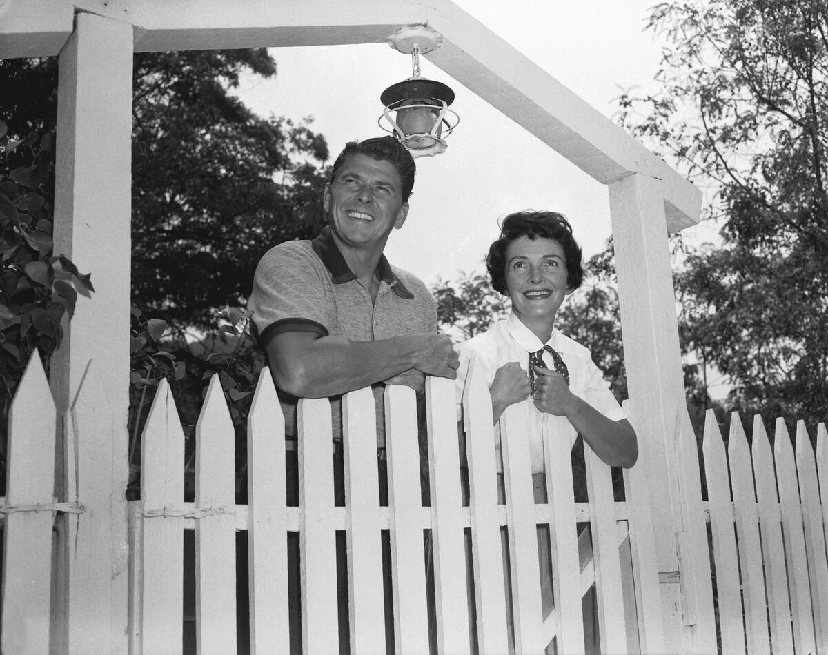Ronald and Nancy Reagan Standing Behind Fence