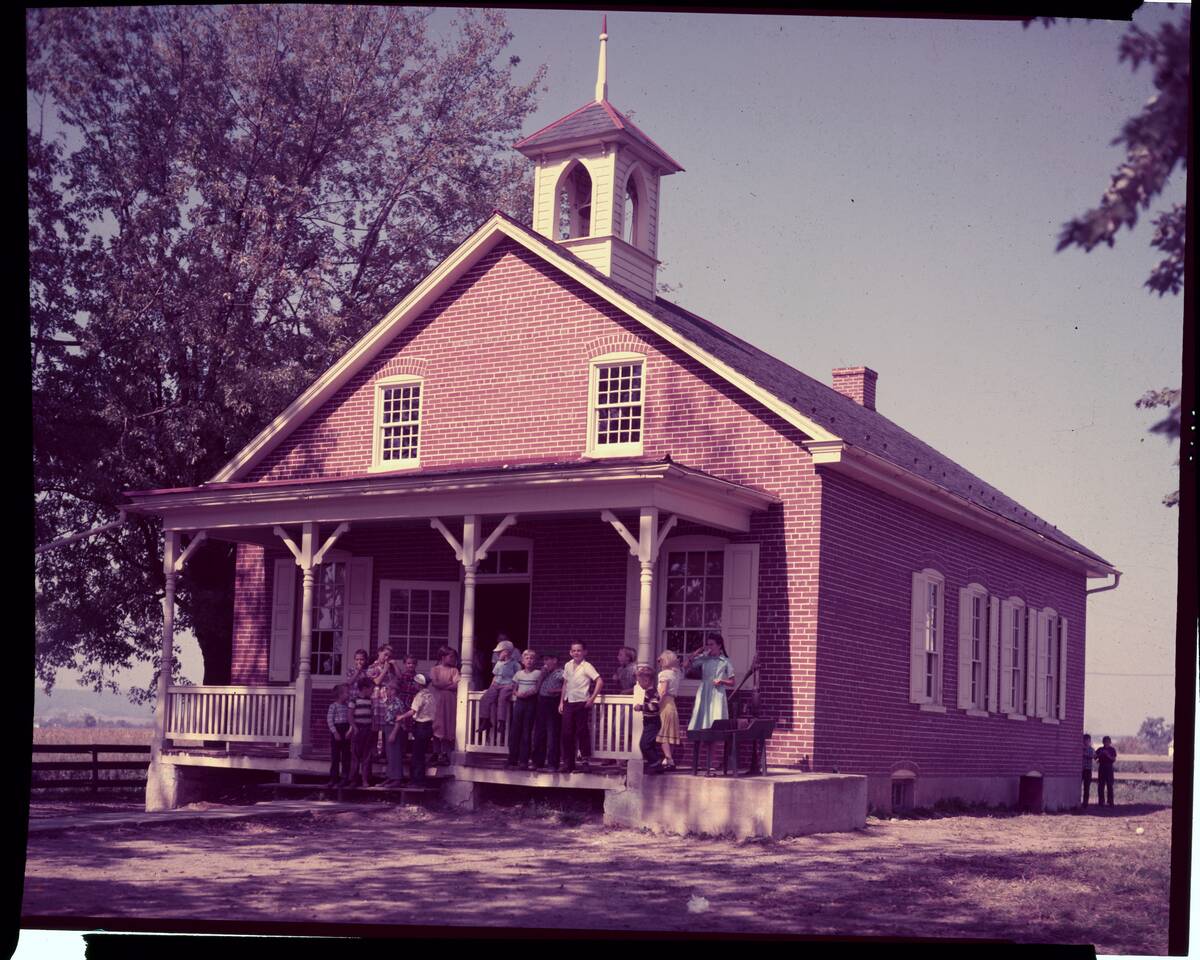 Students Standing on Porch of One Room Schoolhouse